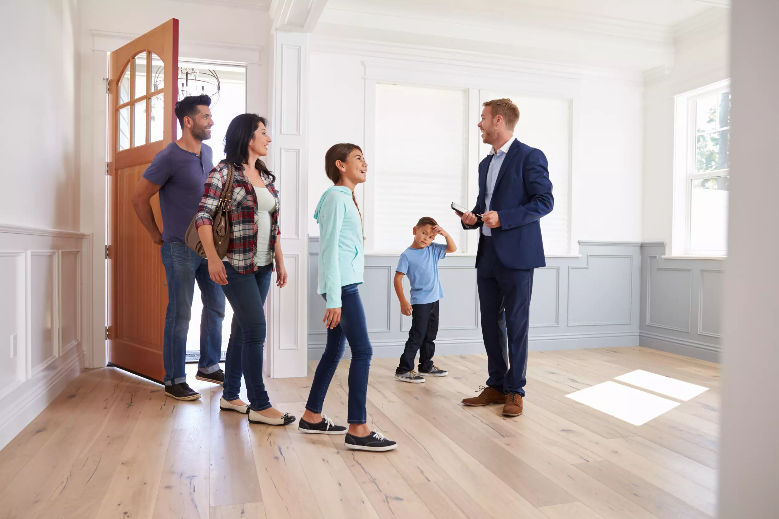 Realtor showing a family a new home